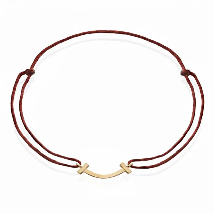 دستبند طلا 18 عیار نخی با پلاک طلا طرح لبخند تیفانی مدل BSG79